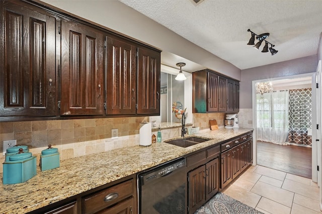 4109 Three Oaks Dr, Arlington, TX 76016 - kitchen featuring black dishwasher, a sink, dark brown cabinets, decorative backsplash, and a textured ceiling