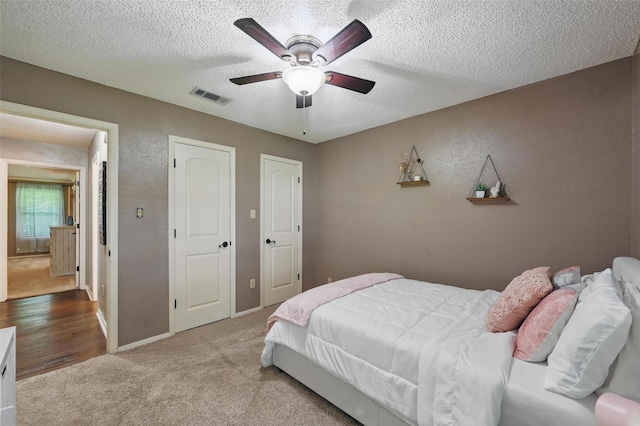 4109 Three Oaks Dr, Arlington, TX 76016 - bedroom featuring carpet flooring, a textured ceiling, a ceiling fan, and baseboards