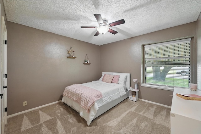 4109 Three Oaks Dr, Arlington, TX 76016 - bedroom featuring carpet floors, a textured ceiling, baseboards, and ceiling fan