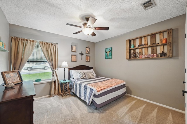 4109 Three Oaks Dr, Arlington, TX 76016 - carpeted bedroom featuring baseboards, a textured ceiling, and ceiling fan