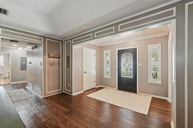 4109 Three Oaks Dr, Arlington, TX 76016 - entrance foyer featuring a textured ceiling, crown molding, dark wood-style floors, and baseboards