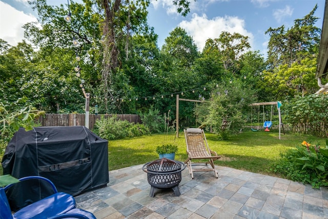 3964 Lost Creek Dr, Dallas, TX 75224 - fenced backyard featuring an outdoor fire pit, a grill, and a patio area