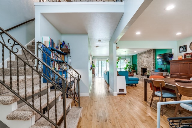 3964 Lost Creek Dr, Dallas, TX 75224 - entryway featuring light wood-type flooring, stairs, recessed lighting, and a fireplace