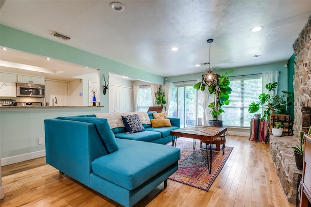 3964 Lost Creek Dr, Dallas, TX 75224 - living area featuring light wood-style floors and recessed lighting