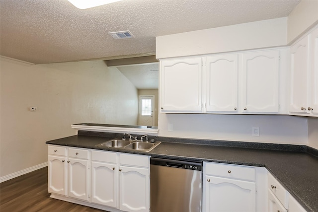 1421 Monica Ct, Mesquite, TX 75149 - kitchen featuring stainless steel dishwasher, a sink, white cabinetry, dark countertops, and a textured ceiling