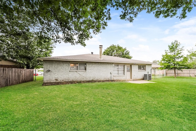 1421 Monica Ct, Mesquite, TX 75149 - back of property featuring cooling unit and brick siding