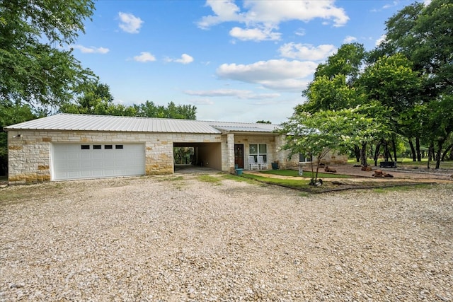 114 Deer Run, Moody, TX 76557 - view of front facade with stone siding, driveway, a garage, and metal roof