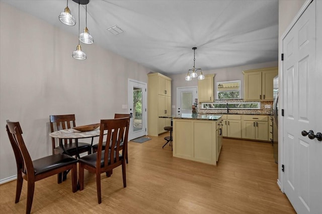 114 Deer Run, Moody, TX 76557 - dining space with light wood finished floors, plenty of natural light, and a chandelier