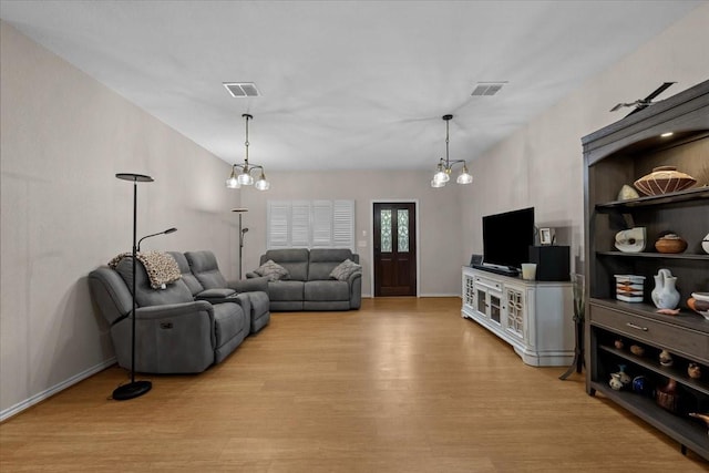 114 Deer Run, Moody, TX 76557 - living room with light wood-style floors, baseboards, and a chandelier