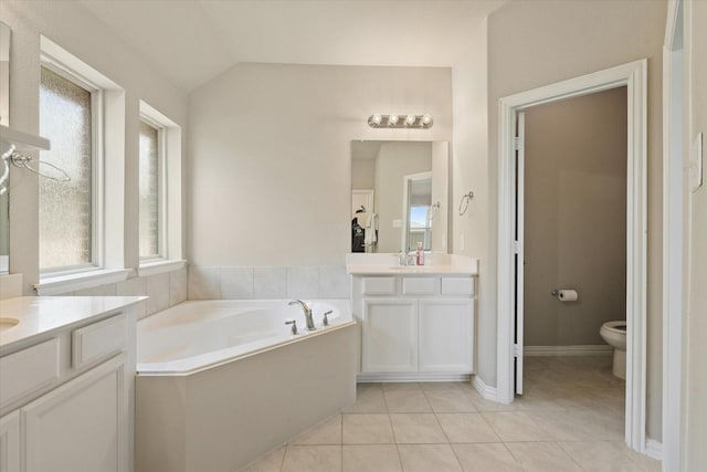2205 Perrymead Dr, Forney, TX 75126 - full bath featuring tile patterned floors, two vanities, a garden tub, and lofted ceiling