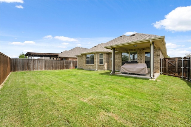 2205 Perrymead Dr, Forney, TX 75126 - rear view of house with brick siding, a fenced backyard, and a shingled roof