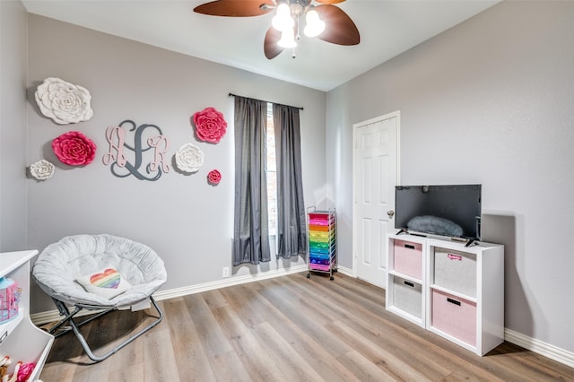 11543 Las Polamas Dr, Frisco, TX 75033 - playroom with light wood finished floors, ceiling fan, and baseboards