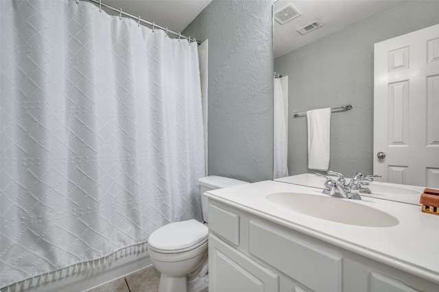 11543 Las Polamas Dr, Frisco, TX 75033 - full bathroom with a textured wall, vanity, toilet, and tile patterned flooring