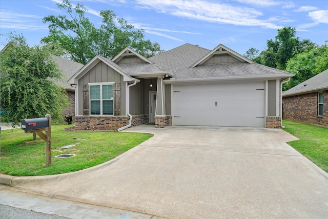 2939 Meadow Brook Trl, Tyler, TX 75701 - view of front of property featuring board and batten siding, brick siding, a front yard, a garage, and driveway