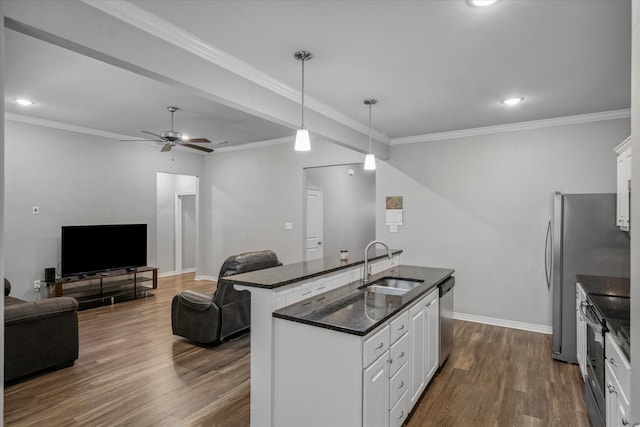 2939 Meadow Brook Trl, Tyler, TX 75701 - kitchen with a sink, appliances with stainless steel finishes, dark wood-style floors, white cabinets, and a ceiling fan
