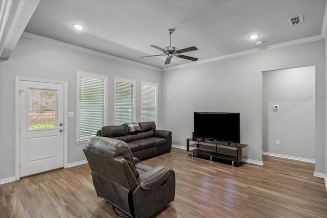 2939 Meadow Brook Trl, Tyler, TX 75701 - living area with healthy amount of natural light, a ceiling fan, wood finished floors, crown molding, and baseboards