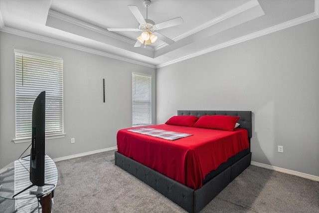 2939 Meadow Brook Trl, Tyler, TX 75701 - bedroom with a raised ceiling, carpet floors, ornamental molding, a ceiling fan, and baseboards