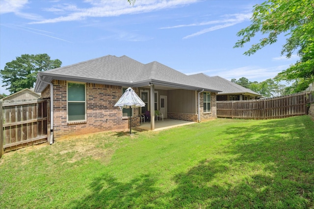 2939 Meadow Brook Trl, Tyler, TX 75701 - rear view of house featuring brick siding, a patio, and a shingled roof
