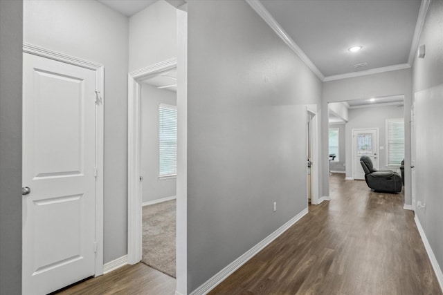 2939 Meadow Brook Trl, Tyler, TX 75701 - hallway with wood finished floors, healthy amount of natural light, baseboards, crown molding, and recessed lighting