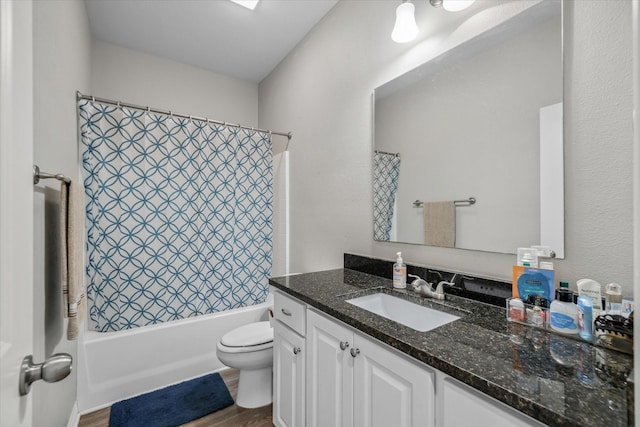 2939 Meadow Brook Trl, Tyler, TX 75701 - bathroom featuring vanity, toilet, wood finished floors, and shower / tub combo