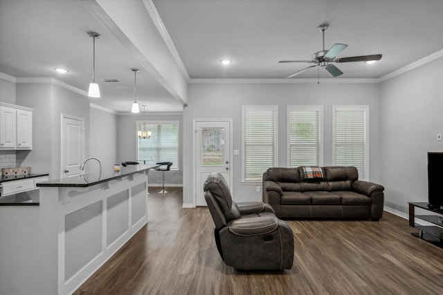 2939 Meadow Brook Trl, Tyler, TX 75701 - living area with dark wood finished floors, a ceiling fan, baseboards, a chandelier, and recessed lighting