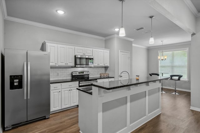 2939 Meadow Brook Trl, Tyler, TX 75701 - kitchen featuring appliances with stainless steel finishes, white cabinets, dark wood-style flooring, crown molding, and baseboards