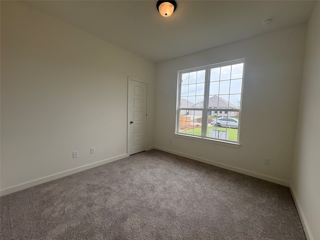 4049 Rimfire Rd, Waco, TX 76705 - spare room with carpet flooring, baseboards, and a smoke detector