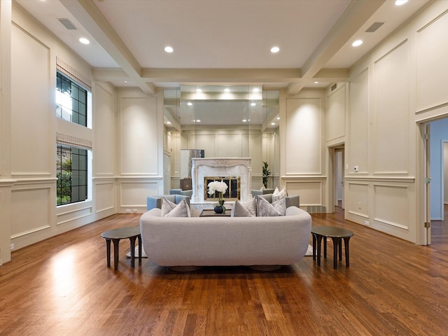 7 Duncannon Ct, Dallas, TX 75225 - living area with a decorative wall, a high end fireplace, wood finished floors, beam ceiling, and recessed lighting