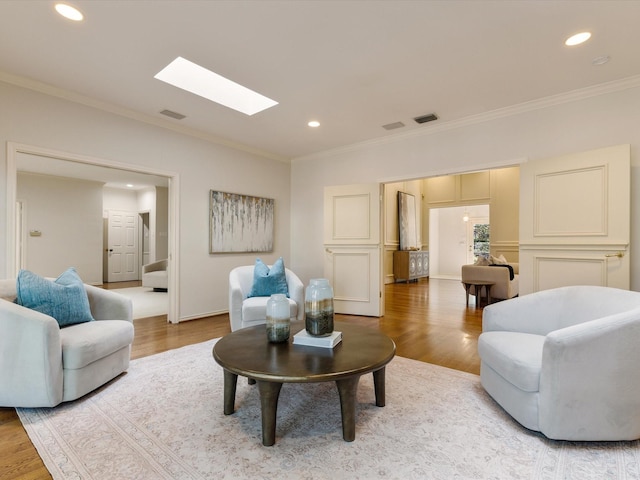 7 Duncannon Ct, Dallas, TX 75225 - living area featuring a skylight, crown molding, wood finished floors, and recessed lighting