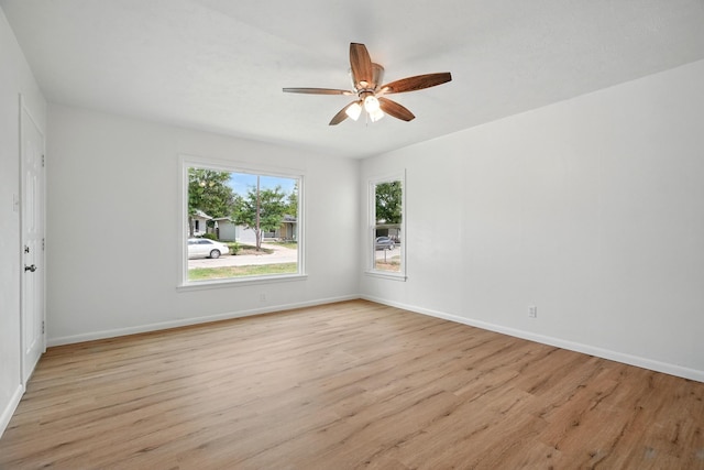 1942 Woodard St, Abilene, TX 79605 - empty room with light wood-style flooring, ceiling fan, and baseboards