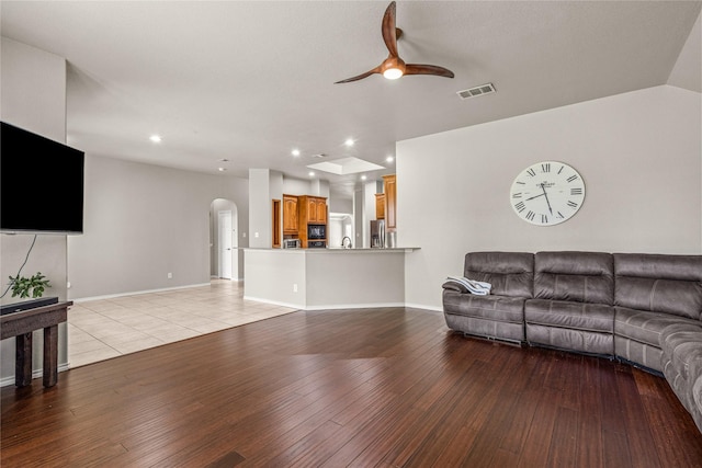 1917 Winter Hawk Dr, Fort Worth, TX 76177 - living area with arched walkways, a ceiling fan, hardwood / wood-style flooring, recessed lighting, and baseboards