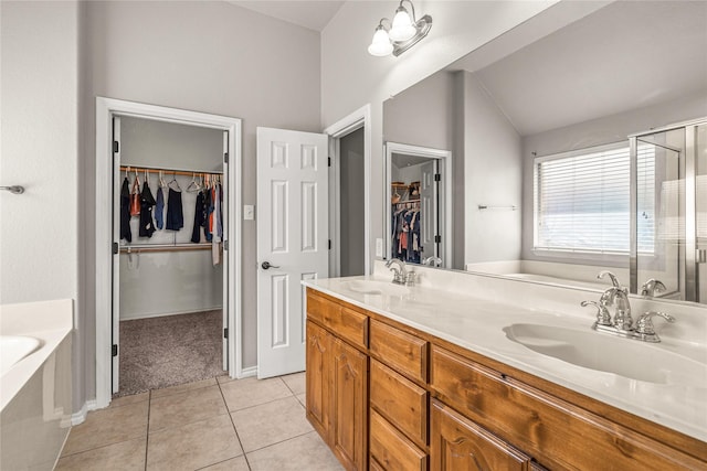 1917 Winter Hawk Dr, Fort Worth, TX 76177 - full bathroom featuring a garden tub, a walk in closet, a stall shower, double vanity, and lofted ceiling