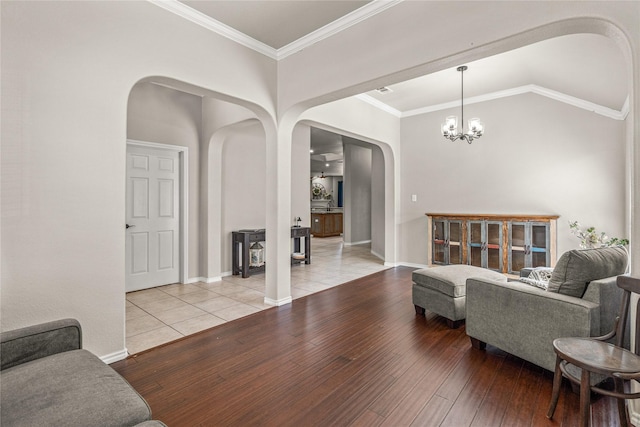 1917 Winter Hawk Dr, Fort Worth, TX 76177 - living area featuring arched walkways, light wood-type flooring, a chandelier, lofted ceiling, and crown molding