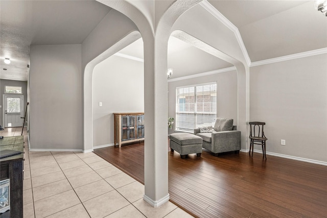 1917 Winter Hawk Dr, Fort Worth, TX 76177 - foyer with lofted ceiling, arched walkways, light wood-style flooring, baseboards, and ornamental molding