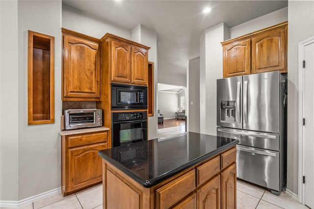 1917 Winter Hawk Dr, Fort Worth, TX 76177 - kitchen with black appliances, light tile patterned flooring, brown cabinets, and recessed lighting