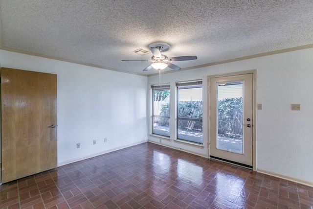 1604 Oak Hollow Dr, Woodway, TX 76712 - unfurnished room with ceiling fan, brick patterned floors, baseboards, and a textured ceiling
