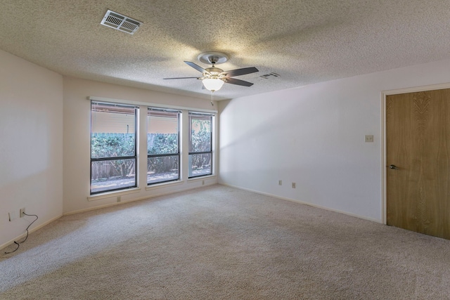 1604 Oak Hollow Dr, Woodway, TX 76712 - carpeted spare room with a ceiling fan and a textured ceiling