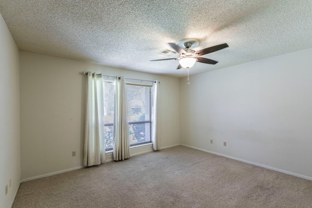 1604 Oak Hollow Dr, Woodway, TX 76712 - carpeted empty room with ceiling fan, a textured ceiling, and baseboards