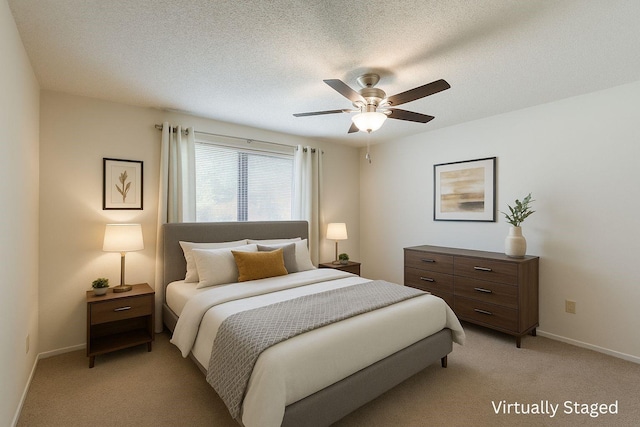 1604 Oak Hollow Dr, Woodway, TX 76712 - bedroom with baseboards, light colored carpet, ceiling fan, and a textured ceiling