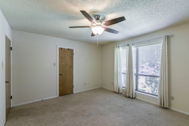1604 Oak Hollow Dr, Woodway, TX 76712 - carpeted spare room with a ceiling fan, a textured ceiling, and baseboards
