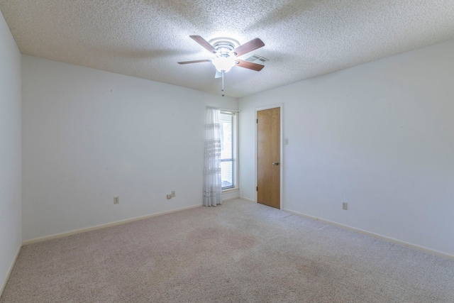 1604 Oak Hollow Dr, Woodway, TX 76712 - carpeted empty room featuring ceiling fan, baseboards, and a textured ceiling