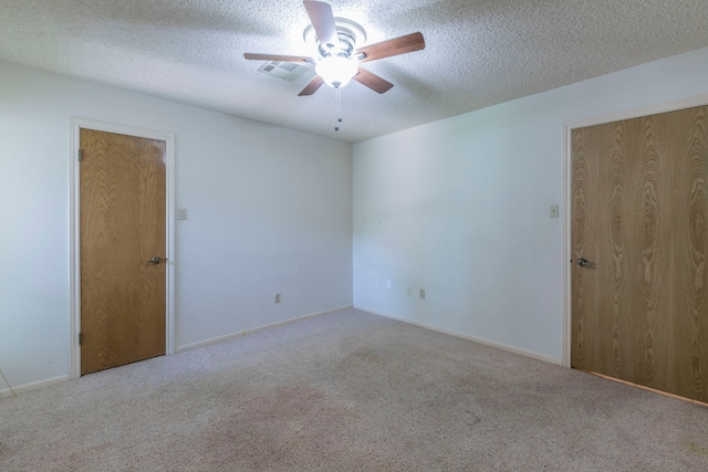 1604 Oak Hollow Dr, Woodway, TX 76712 - empty room with carpet, ceiling fan, and a textured ceiling