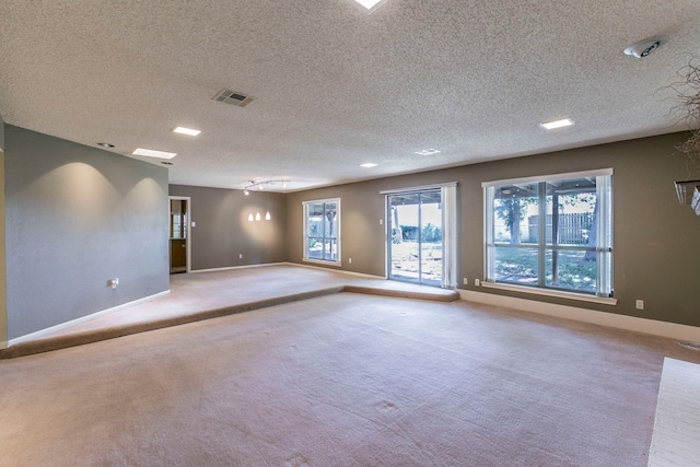 1604 Oak Hollow Dr, Woodway, TX 76712 - unfurnished room with baseboards, light colored carpet, and a textured ceiling