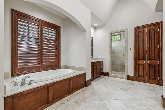44 Armstrong Dr, Frisco, TX 75034 - bathroom featuring a shower stall, a bath, vanity, and vaulted ceiling