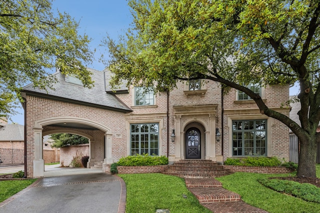 44 Armstrong Dr, Frisco, TX 75034 - view of front of house with brick siding, a front lawn, and a high end roof