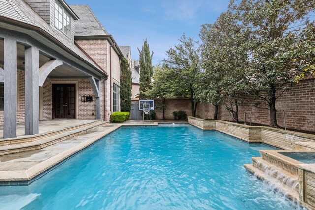 44 Armstrong Dr, Frisco, TX 75034 - view of pool featuring french doors, a fenced backyard, a patio area, and a pool with connected hot tub