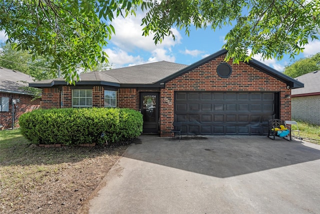 1012 Hatton St, Waco, TX 76704 - ranch-style home with brick siding, a garage, and concrete driveway