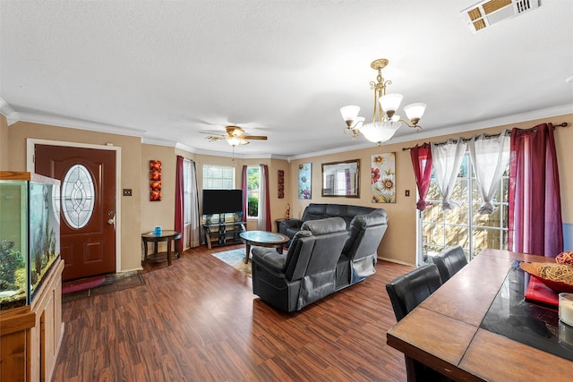 1012 Hatton St, Waco, TX 76704 - living room featuring a chandelier, dark wood finished floors, ornamental molding, ceiling fan, and baseboards
