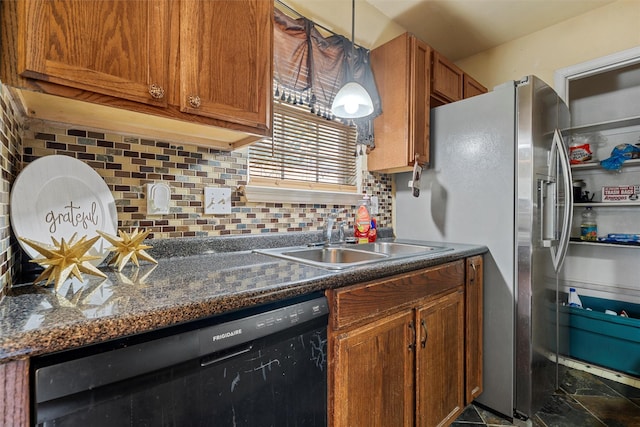 1012 Hatton St, Waco, TX 76704 - kitchen with black dishwasher, a sink, brown cabinets, decorative backsplash, and dark countertops