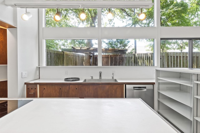 1703 E Barbara St, Tyler, TX 75701 - kitchen featuring dishwasher, a sink, and light countertops